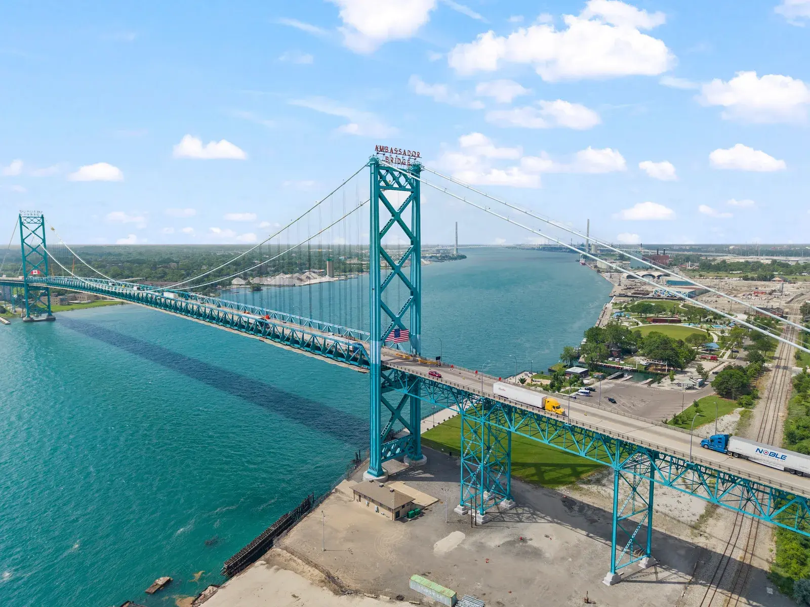 Aerial drone view of the Ambassador Bridge connecting Detroit and Windsor