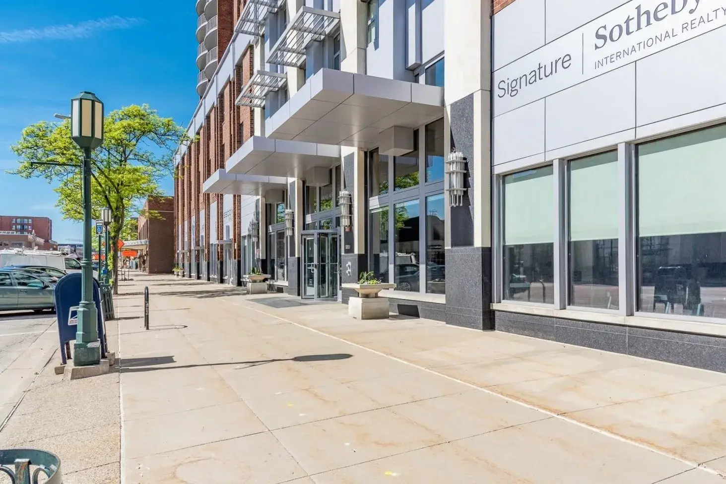 Sidewalk view of a commercial building's entrance