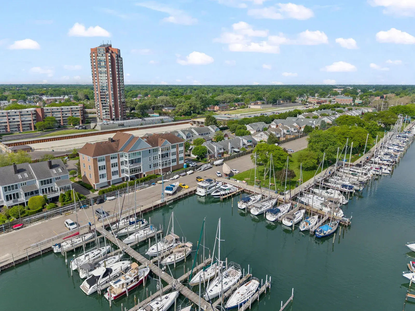 Aerial drone view of a lakefront with boat docks