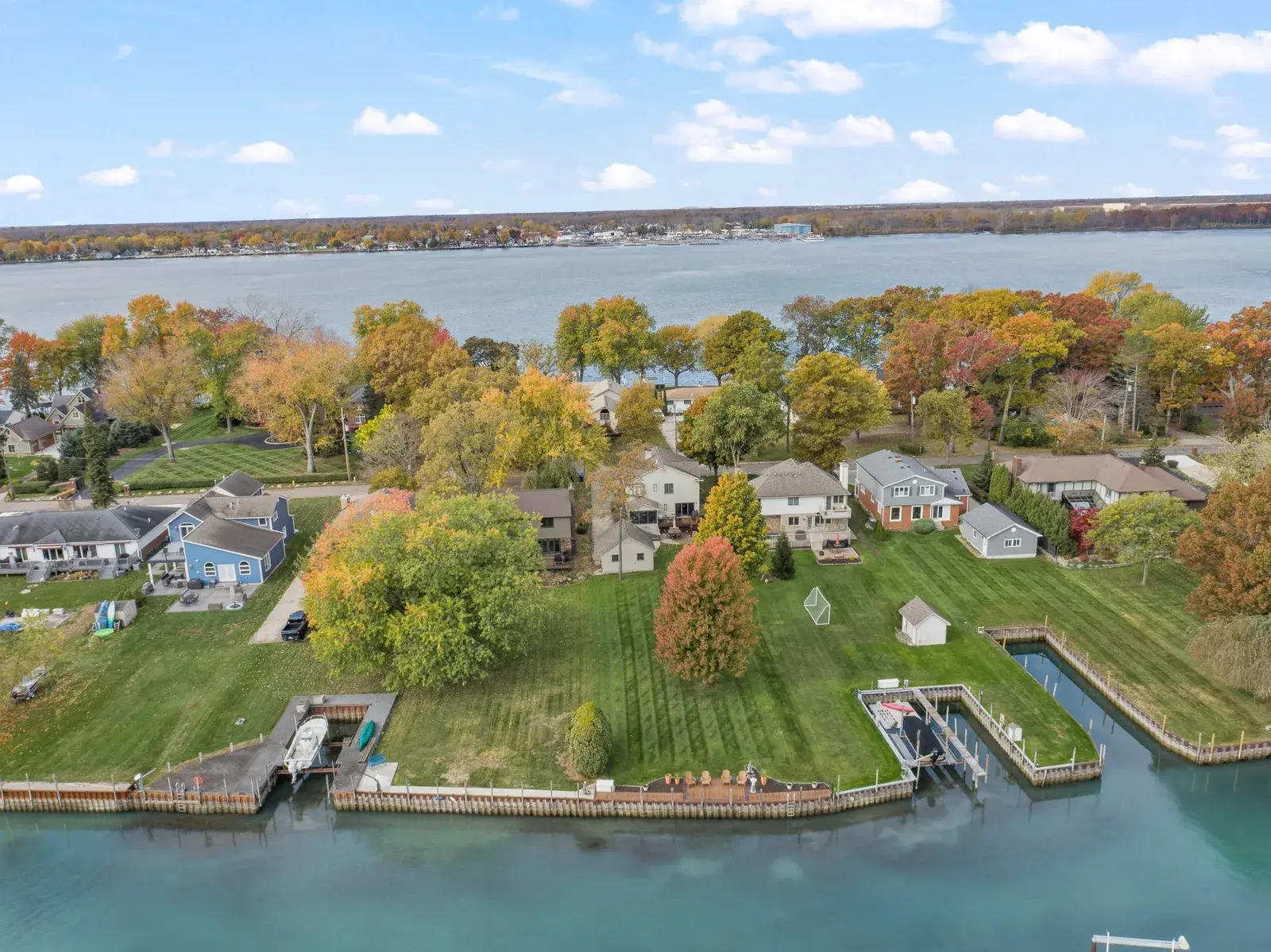 Aerial drone view of a lakefront with water on both sides