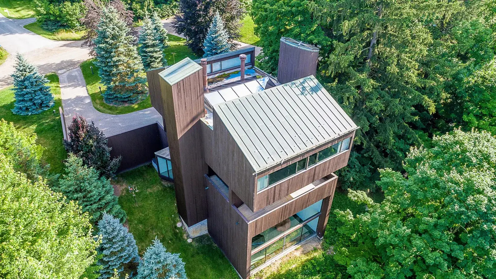 Overhead aerial drone view of a modern wood and metal home