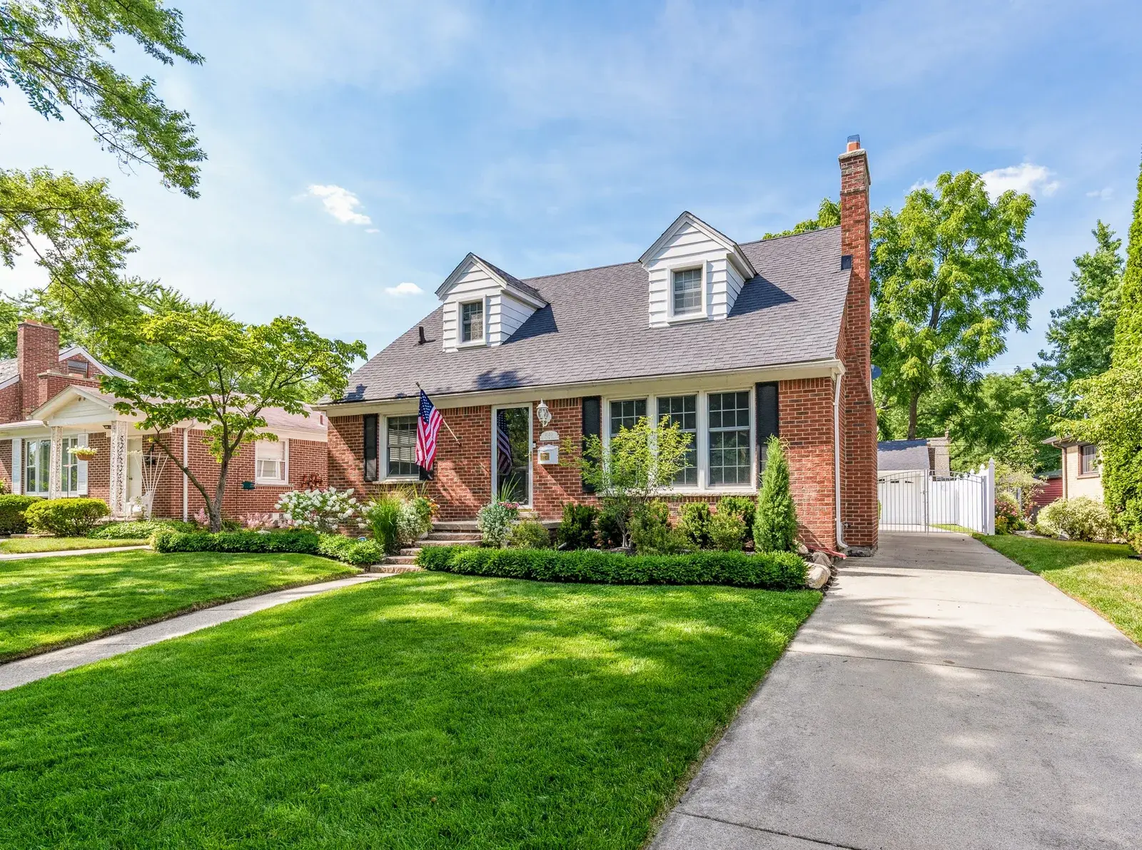 Front lawn and driveway view of a home