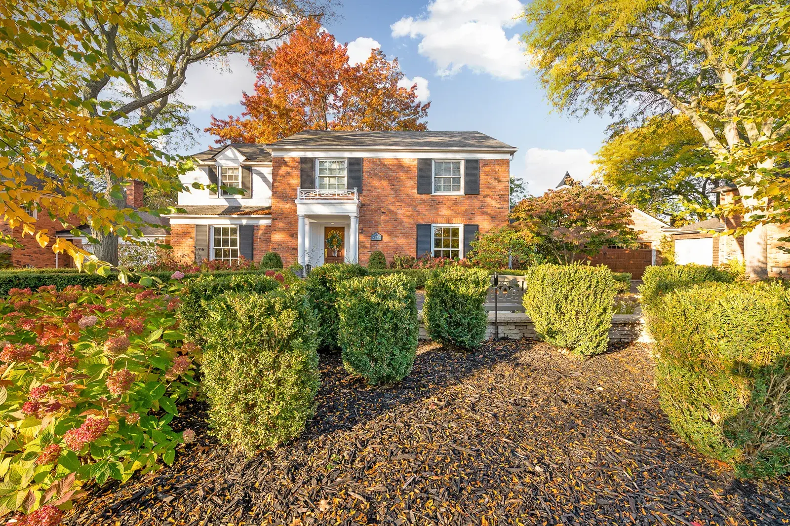Front lawn of a home with a garden out front