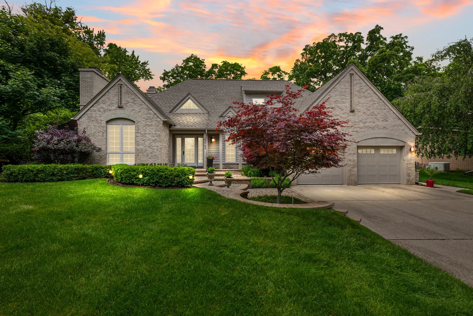 Front lawn view of a suburban home at sunset