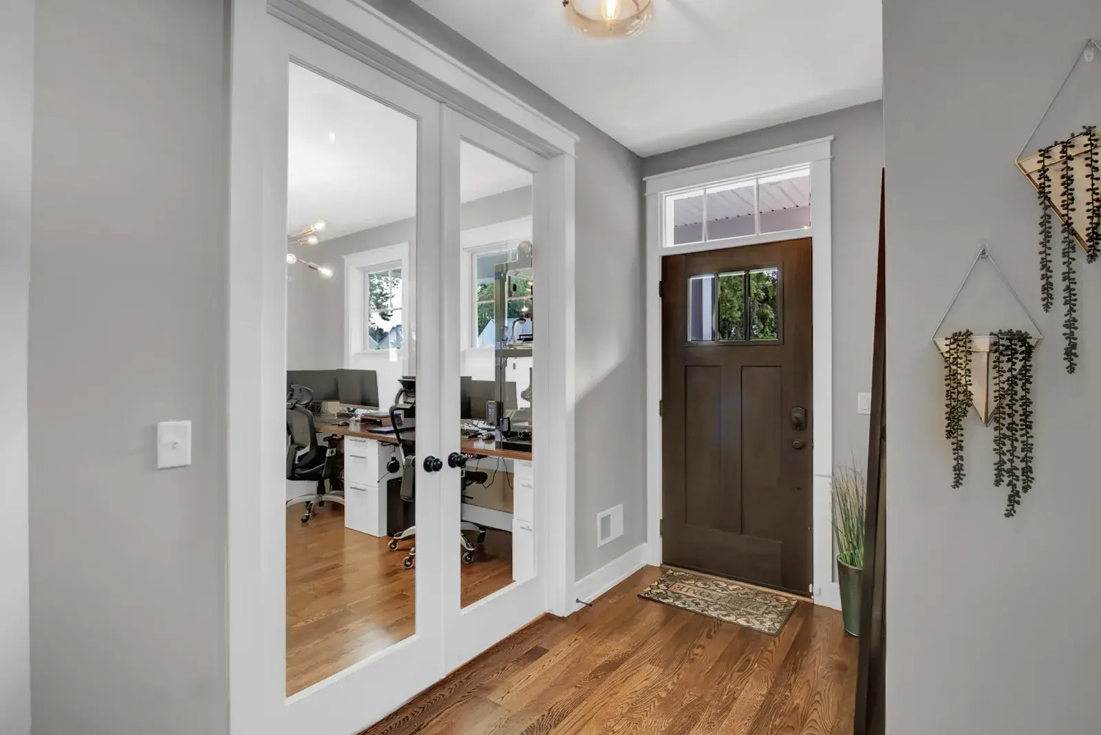 Interior view of a front door and office room