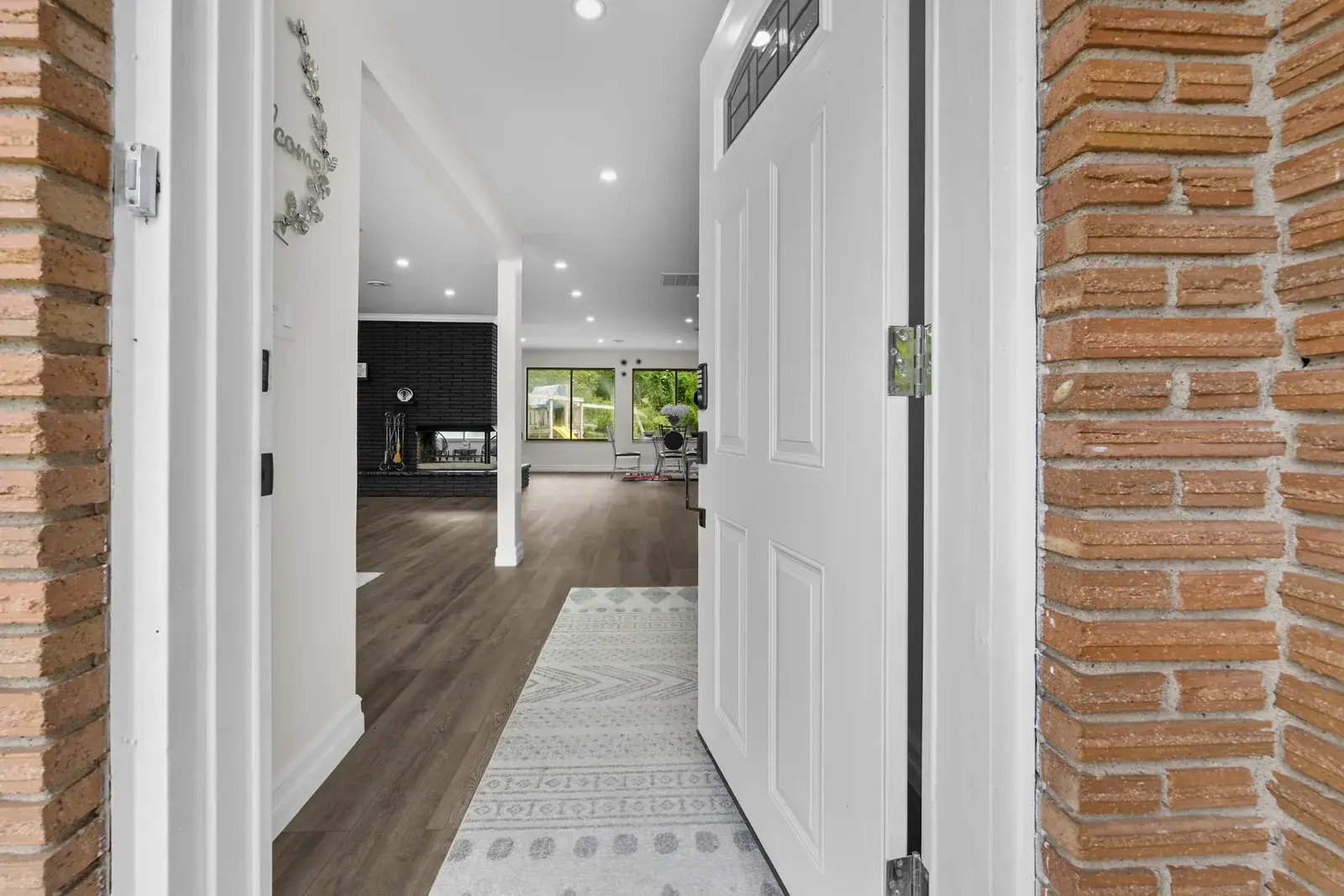 View from a home's front door into the interior hallway and living area