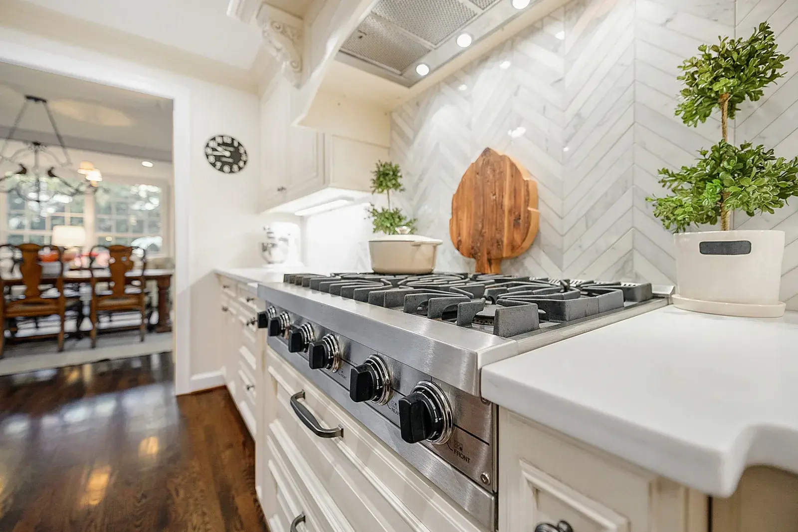 Closeup interior view of a kitchen, focused on the stove area