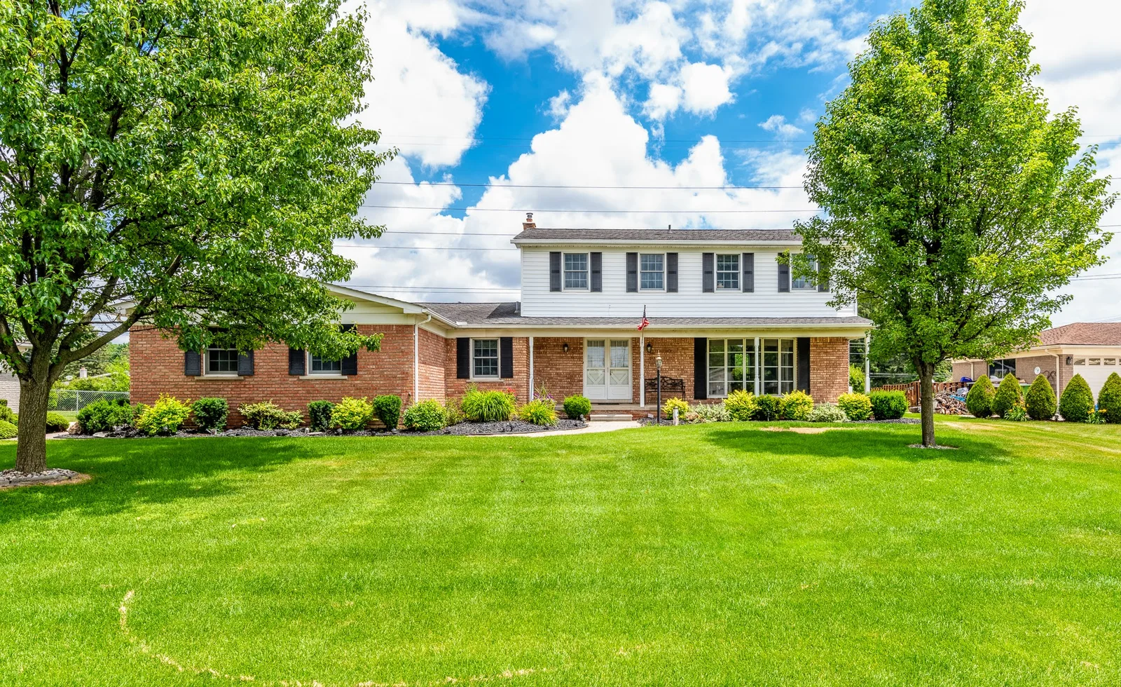 Front lawn exterior view of a suburban home, residential real estate photography in Genesee County