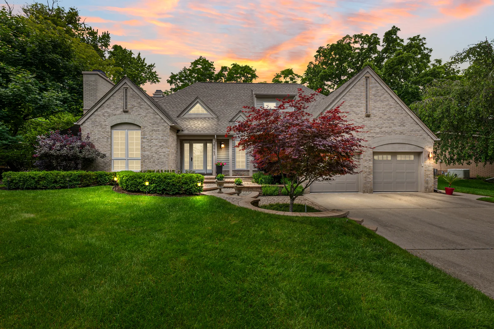 Front lawn view of a suburban home at sunset